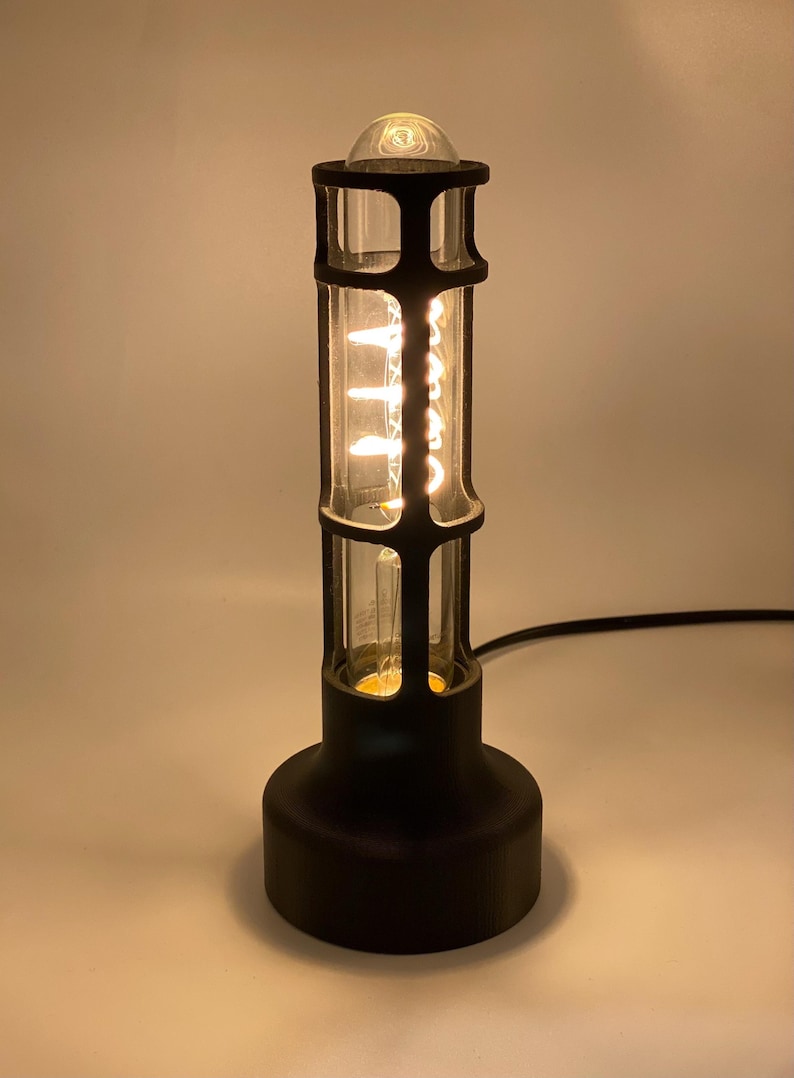 Retro Style Lamp Edison Bulb Feature Vintage Industrial Design Table Lamp Elegance Minimal Aesthetic Appeal Warm Glow Lighting Ambient Atmosphere Creator Bedside Table Accessory Reading Light Perfect Desk Companion Cylindrical Shape