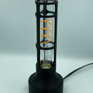 Industrial Design Lamp Vintage Table Lighting Edison Bulb Highlight Warm Glow Creator Ambient Light Source Minimal Aesthetic Appeal Cylindrical Shape Structure Bedside Lamp Perfect Reading Light Desk Accessory Stylish Home Addition Modern