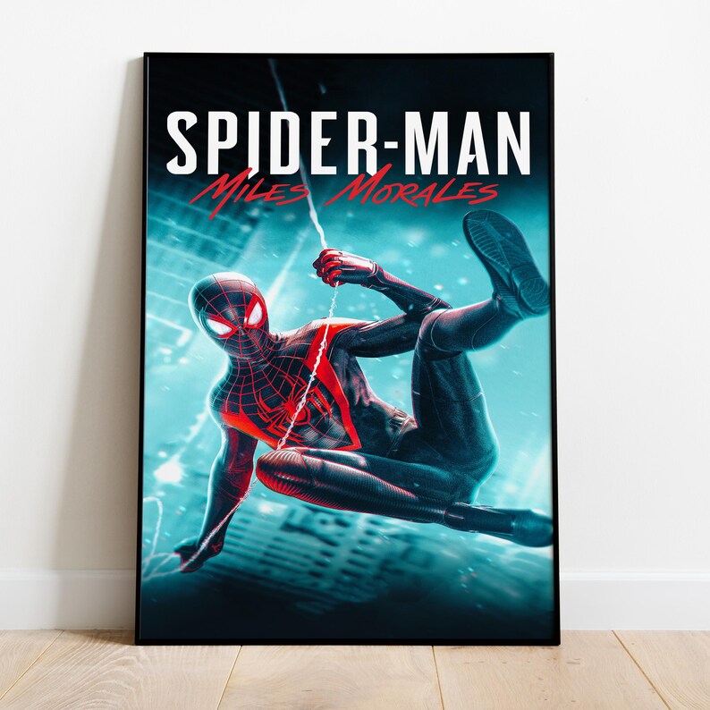 May include: A framed poster featuring Spider-Man Miles Morales in a dynamic pose against a teal and blue cityscape. The title "SPIDER-MAN Miles Morales" is displayed in white and red text at the top. The superhero is clad in a black and red suit.