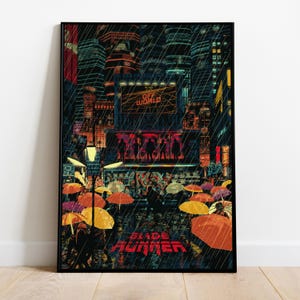 May include: A framed art print depicting a neon-lit cityscape in the rain. The artwork shows a futuristic urban scene with the text "OFF WORLD" and "BLADE RUNNER". Colourful umbrellas and figures are visible in the foreground.