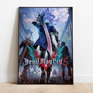 May include: A framed poster featuring the "Devil May Cry 5" video game. The artwork depicts three characters in a city setting, with the central figure holding a large sword. The game's logo is prominently displayed with a red and blue color scheme.