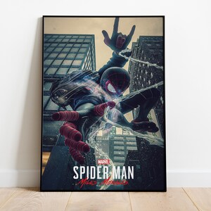 May include: Framed poster featuring Spider-Man in a dynamic pose amidst city skyscrapers. The artwork showcases Spider-Man in a black and red suit, with web-slinging action. The Marvel logo and "Spider-Man: Miles Morales" text are visible.