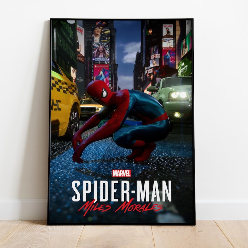 May include: A framed poster featuring Spider-Man in a crouched position on a wet street. The superhero is wearing a red and blue suit. The poster includes the Marvel logo and the text "SPIDER-MAN Miles Morales."