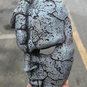 May include: A handmade wooden sign with the text "Welcome to our home" in a handwritten style. The sign is painted white with a distressed finish and a dark brown border. A small, decorative heart is attached to the bottom.