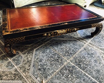 Circa 1940s Rectangular Low Rise Hand-Painted Asian Coffee Table With Oxblood Red Leather Tabletop Insert With Gold Accents