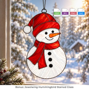 May include: A stained glass snowman ornament featuring a red hat and scarf, a bright orange carrot nose, and three black circular buttons. The snowman is constructed from white textured glass and hangs from a black metal chain loop.