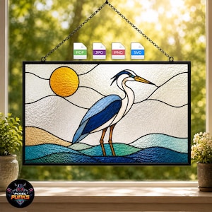 May include: A rectangular stained glass panel featuring a blue and white heron standing in water with a yellow sun in the background. The design includes black lead lines and is suspended by a metal chain. File icons for PDF, JPG, PNG, and SVG are visible.