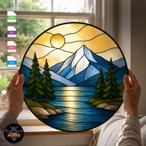 May include: A circular stained glass panel featuring a mountain landscape with a white snow-capped peak, deep blue mountain ranges, a reflective blue lake, and green pine trees under a golden yellow sun in a clear sky with black lead lines.