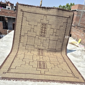 Large rectangular Tuareg jute leather rug for neutral home styling, organic interiors, and earthy room decor