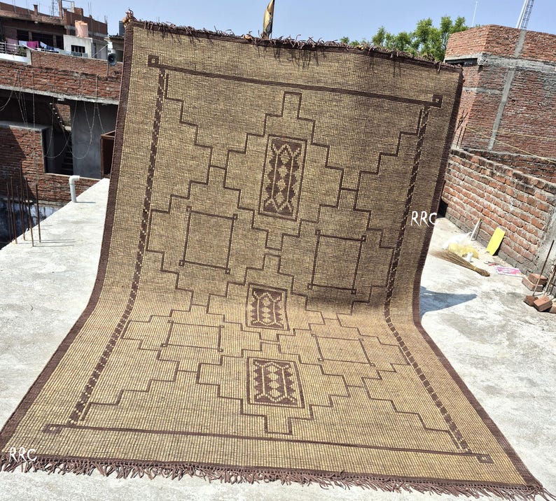 Large rectangular Tuareg jute leather rug for neutral home styling, organic interiors, and earthy room decor