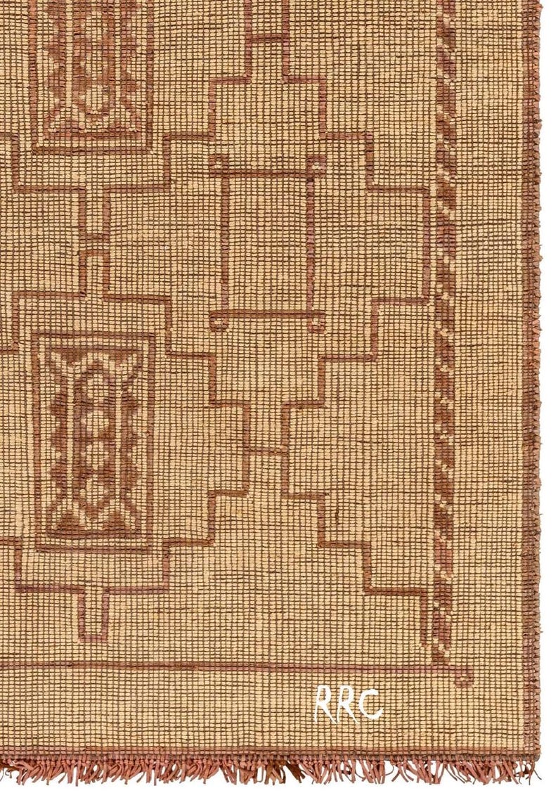 Luxury handmade Tuareg tribal carpet with earthy tones and woven texture for modern organic interior design