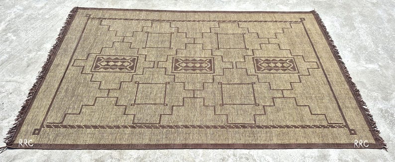 Rustic bohemian Tuareg rug with handwoven jute and leather details for luxury farmhouse bedroom decor