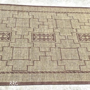 Authentic handmade Tuareg jute and leather area rug with Moroccan tribal pattern for boho living room and rustic home decor