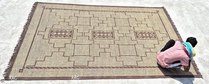 Authentic handmade Tuareg jute and leather area rug with Moroccan tribal pattern for boho living room and rustic home decor