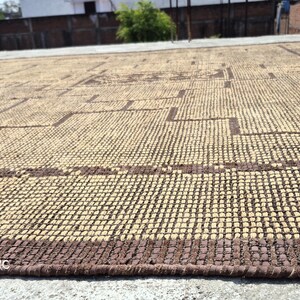 Handmade African Tuareg rug with geometric tribal pattern for elegant living room, office, and entryway flooring