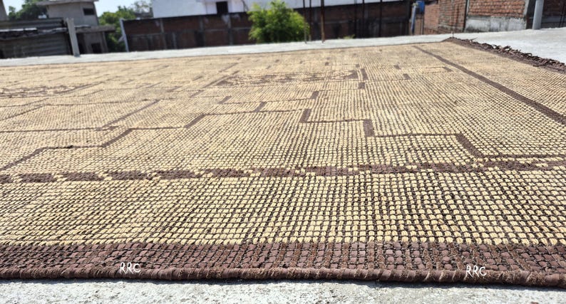 Handmade African Tuareg rug with geometric tribal pattern for elegant living room, office, and entryway flooring