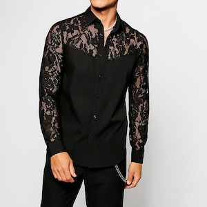 May include: Black button-down shirt with lace sleeves and yoke. The shirt features a classic collar and buttoned cuffs. The lace is a contrasting color, adding a unique design element to the garment.
