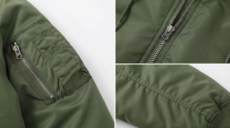 K&ouml;nnte beinhalten: Nahaufnahme einer olivgr&uuml;nen Bomberjacke. Details sind eine Rei&szlig;verschlusstasche, ein Metallrei&szlig;verschluss und gerippte B&uuml;ndchen. Die Jacke hat ein glattes, mattes Finish und ein klassisches Design.