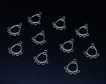 May include: Ten silver teardrop-shaped metal earring findings with five small circles around the top of each teardrop.