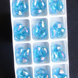 12pc - 6mm Thunder Polish Crystal Faceted Light Aquamarine Blue AB 2X Rugby Barrel Spacer Beads
