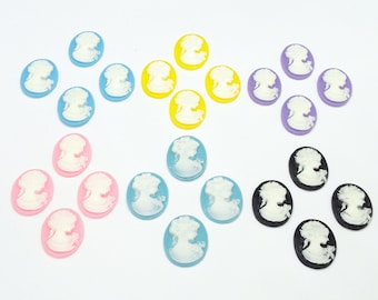 May include: A collection of oval-shaped cameo pendants in various colors, including blue, yellow, purple, pink, and black. Each cameo features a white profile of a woman. These pendants are ideal for jewelry making and crafting.