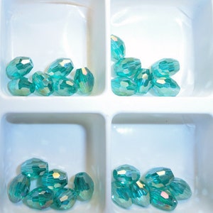 12pc - 6mm Thunder Polish Crystal Faceted Light Malachite Green AB 2X Rugby Barrel Spacer Beads