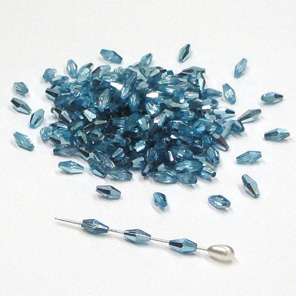 12pc - 6mm Thunder Polish Crystal Faceted METALLIC AQUAMARINE BLUE Elongated Bicone Spacer Beads