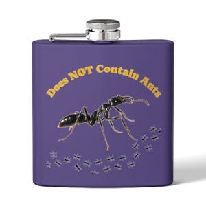 May include: A purple hip flask with a silver cap and hinge. The flask has a black ant graphic and the text "Does NOT Contain Ants" in yellow. A trail of small ant graphics is also present.