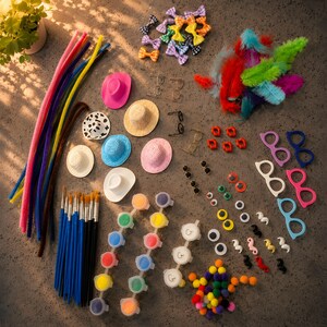 May include: A craft supply kit featuring colorful pipe cleaners, miniature hats in various colors and patterns, small bows, feathers, paintbrushes, paint pots, googly eyes, plastic glasses frames, and small pom-poms arranged on a flat surface.