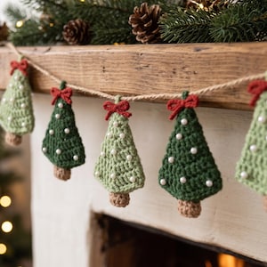 May include: A crochet garland featuring alternating light and dark green triangular tree shapes. Each tree is topped with a small red yarn bow and decorated with white beads. The trees are attached to a thin, natural-colored twine string.
