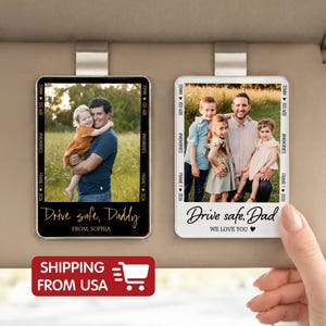 May include: Two car visor photo holders with family photos. One has the text "Drive safe, Daddy" and "From, Sophia". The other says "Drive safe, Dad, We love you". Both have a black and white border.