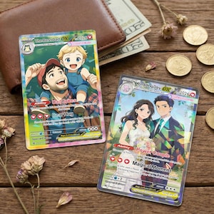 May include: Two collectible cards with illustrations. One features a father and child with text "The Best Dad EX 2026". The other shows a couple with text "Wedding Day EX 2026". The cards are on a wooden surface with coins, cash, and a wallet.