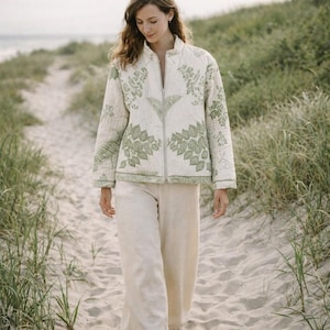 May include: A set of three ceramic mugs with a speckled, matte finish. The mugs are in shades of cream, light gray, and dark gray. Each mug has a simple, minimalist design, perfect for coffee or tea.