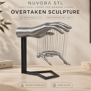 May include: A silver-colored sculpture featuring a large hand suspended above a smaller human figure, connected by thin vertical strings. The sculpture is mounted on a black L-shaped stand. Text reads NUVORA STL, OVERTAKEN SCULPTURE, 3D PRINTABLE STL, CONTEMPORARY ART, INSTANT DOWNLOAD, HOME DECOR.