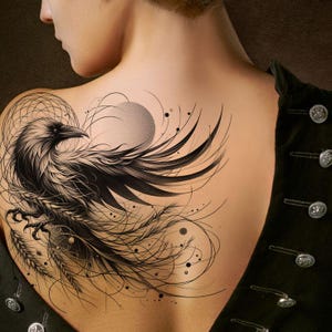 May include: A black and white tattoo of a raven with outstretched wings, a sun, and abstract lines is visible on the back. The raven's feathers are intricately drawn, creating a sense of movement. The design is set against a light skin tone.