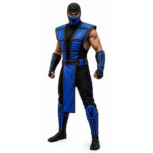 Puede incluir: Figura de acción de un personaje con un traje negro y azul. La figura lleva una máscara negra, un chaleco azul y negro, pantalones negros y rodilleras azules. La figura posa con los puños cerrados.