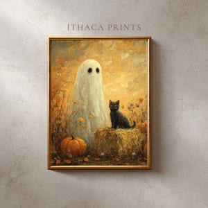 Könnte beinhalten: Ein gerahmter Halloween-Druck mit einem weißen Geist mit schwarzen Augen, einer schwarzen Katze und Kürbissen. Das Kunstwerk hat eine warme Farbpalette aus Orange, Gelb und Braun, mit dem Text "ITHACA PRINTS" oben.