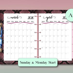 May include: A planner open to March and April 2026, with a pink binding and a decorative cover. The calendar pages are white with black text, and the design includes the text "Sunday & Monday Start" and "A5". A blue pen is visible on the left.