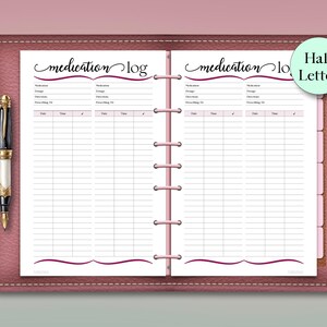 May include: A pink leather-bound planner with a medication log. The log has sections for medication, dosage, directions, and a space to record the date and time. A pen with a gold and black design is on the left.