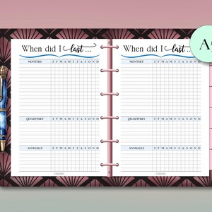 May include: A5-sized planner insert with a pink and brown art deco design. The insert features a grid layout for tracking monthly, quarterly, and annual events. Text reads "When did I last..." and includes a pen.