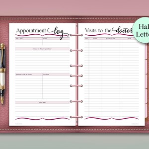 May include: A pink leather-bound planner with a pen. The planner is open to a page with the words "Appointment Log" and "Visits to the Doctor." The pages have lines for recording information. A "Half Letter" sticker is on the right page.