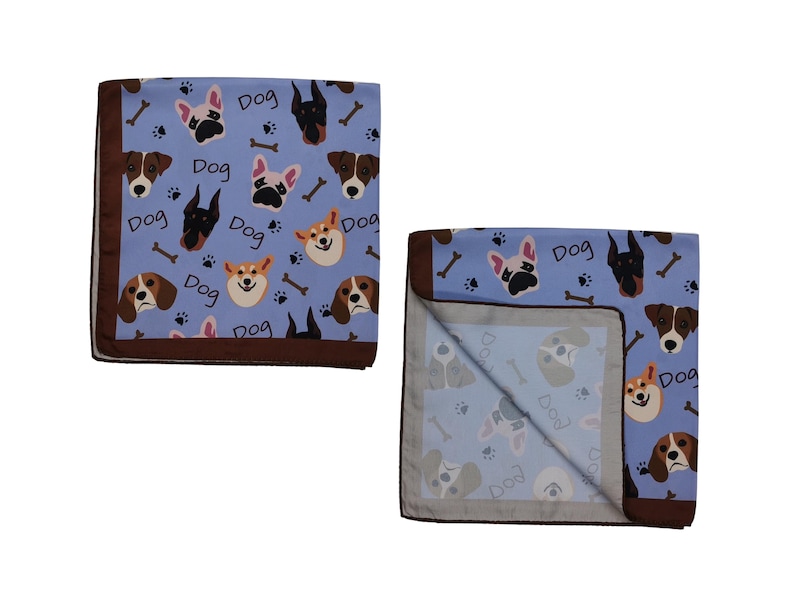 May include: Two blue dog-themed blankets with a brown border. The blankets feature various dog breeds, bones, paw prints, and the word "Dog" in white. One blanket is folded, revealing the underside with a similar pattern.