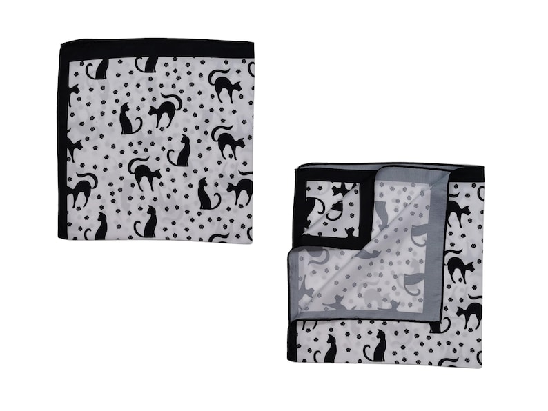 May include: A white pocket square with a black border and a repeating pattern of black cat silhouettes and small black dots. One pocket square is folded, revealing the interior pattern.