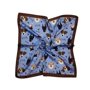 May include: A square, light blue scarf with a repeating pattern of various dog breeds, bones, and paw prints. The word "Dog" is also printed on the scarf. The scarf has a dark brown border.