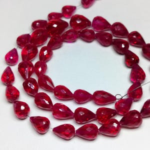 extremely rare AAAA++ quality Ruby Faceted Teardrop Beads | 6x8mm-7x9mm Red Briolettes (Wholesale Strands)