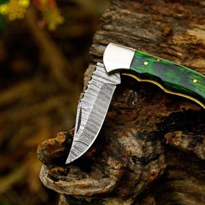 Handmade Damascus Steel Folding Knife: Ebony Handle, Leather Sheath