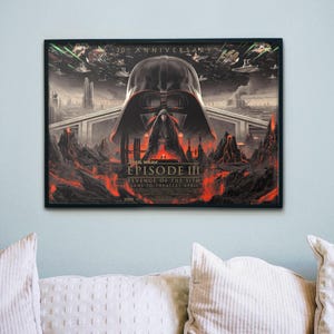 May include: Framed Star Wars Episode III: Revenge of the Sith movie poster. The artwork features Darth Vader's helmet, a fiery landscape, and the film's title. The poster is a 20th Anniversary edition.