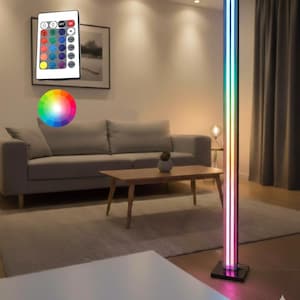 May include: A contemporary LED floor lamp with colour-changing capabilities and a remote control. The lamp has a tall, rectangular design with vertical light strips displaying a range of colours. The remote control is visible, along with a colour wheel.