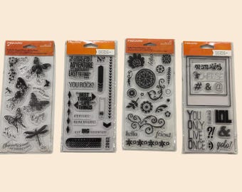 Juegos de sellos transparentes Fiskars: Mariposas, Aventuras, Flores, Sentimientos. Materiales para scrapbooking y tarjetas.