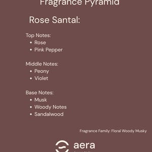 May include: A brown informational graphic titled Fragrance Pyramid for Rose Santal. It lists top notes of rose and pink pepper, middle notes of peony and violet, and base notes of musk, woody notes, and sandalwood. The text includes Fragrance Family: Floral Woody Musky and the aera Aroma Atelier logo.